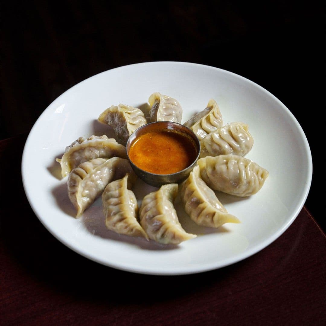 Discover the Delightful Taste of Everest Cuisine’s Chicken Momos: A Heavenly Experience